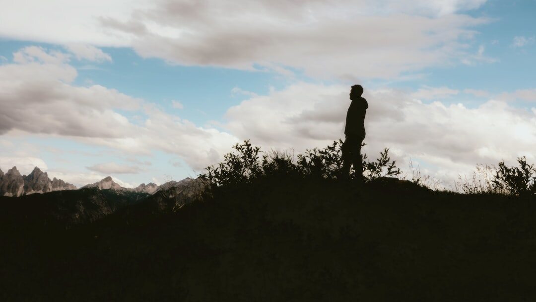 person standing confidently on mountain