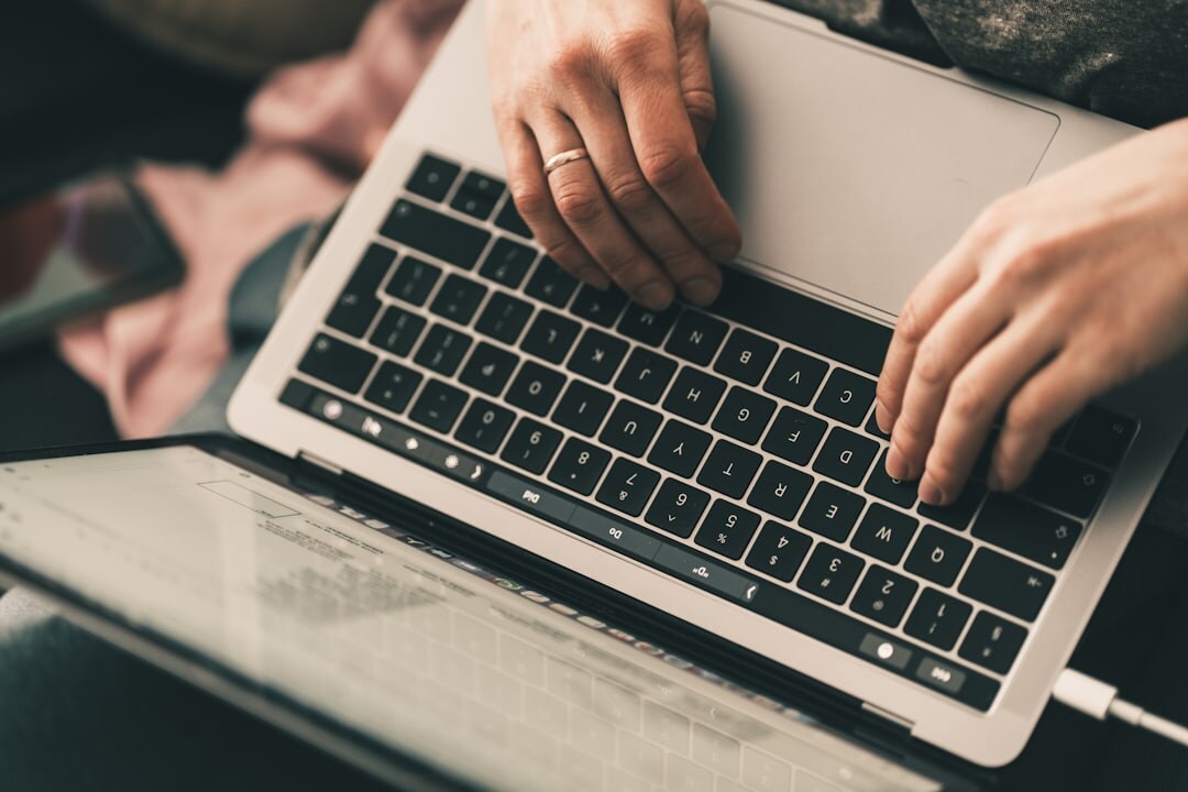 person writing blog post on laptop