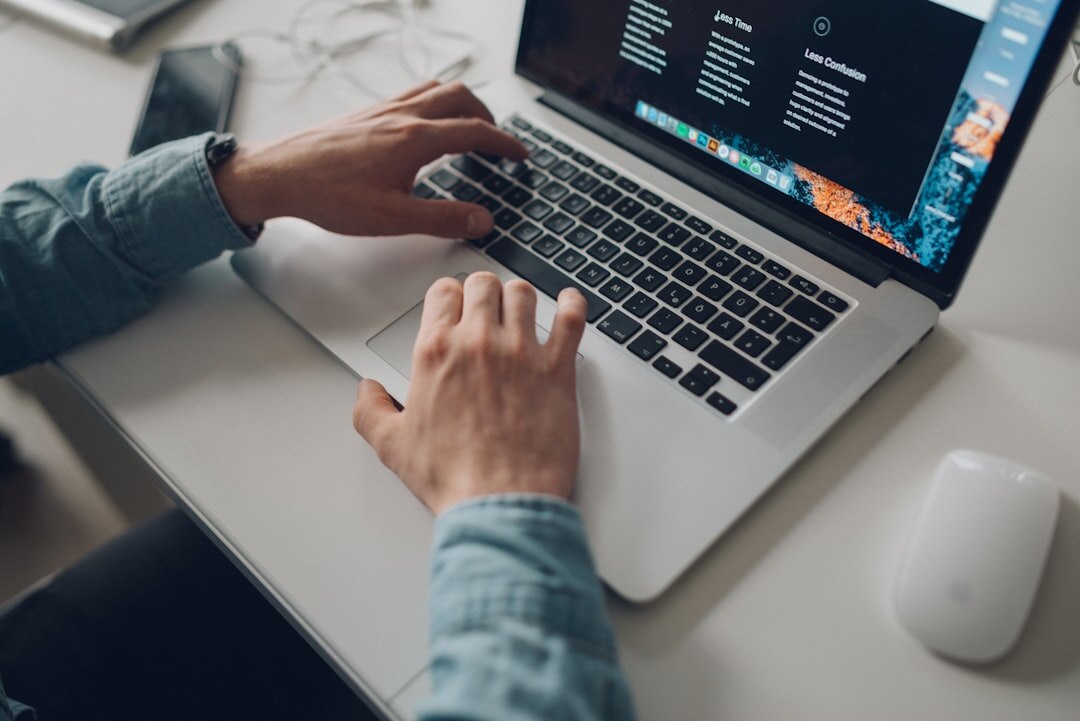 person writing blog post on laptop
